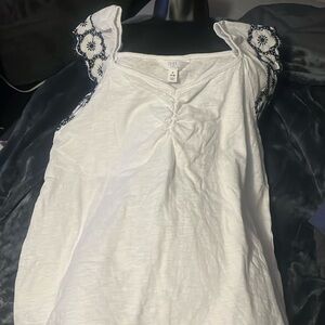 White and blue blouse.